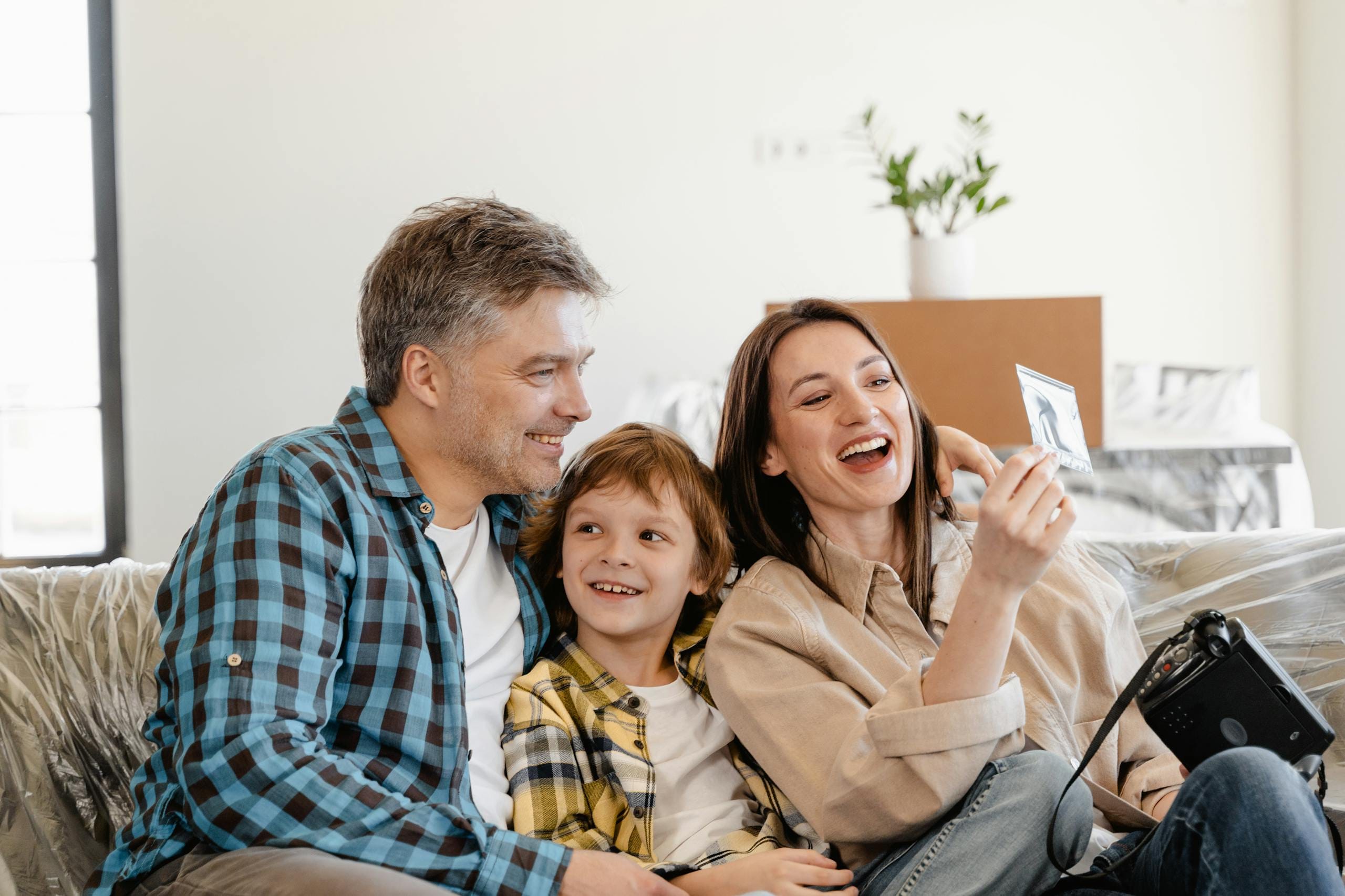 Family happy with air purification installed by Quam Comfort
